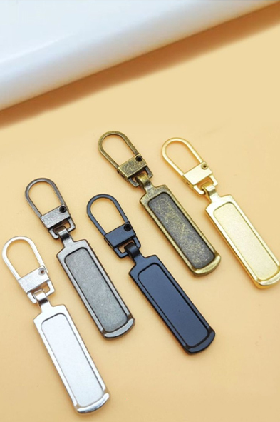 Sleamhnán Zipper agus Tarraingeoir